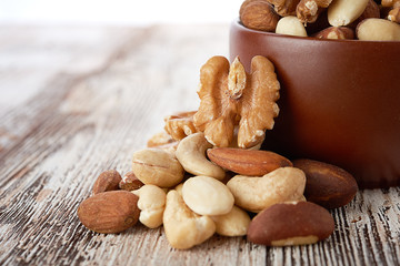 Mix nuts on wooden background