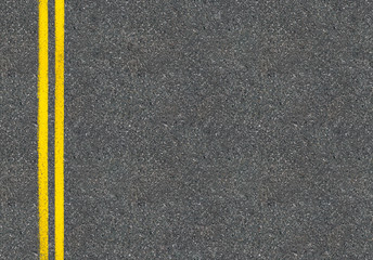 Asphalt road top view with two yellow lines