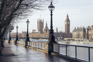 Early in the morning in central London with footpath, Big Ben and Houses of Parliament - London, UK