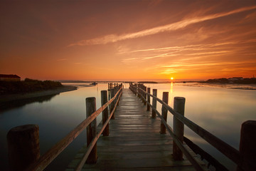 old sea pier at sunrise