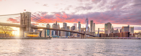 Beautiful sunset over brooklyn bridge in New York City