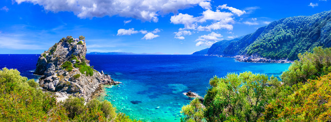 Beautiful Greek islands- Skopelos. view of rock and church Agios Ioanis. northen Sporades