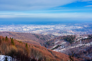Panoramic view of Bielsko Biala city from the slopes of Szyndzielnia in Beskid Slaski, Poland. Bielsko is a city located at the foot of the mountains with good tourist infrastructure.