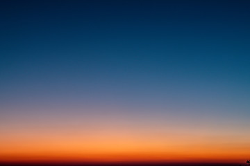 Sky gradient from blue to orange sunset