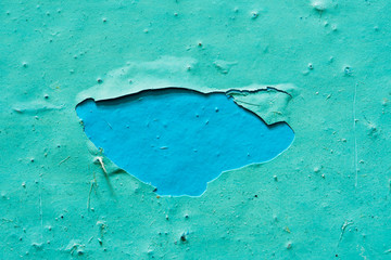 Peeling Blue Aquamarine Color Paint from the Wall. Tło Shattered Plaster