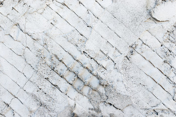 Tło, metalowa siatka pokryta i rozmazana betonem.