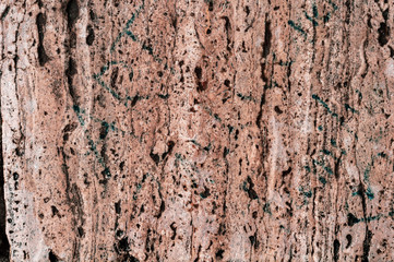 tło brązowy teksturowanej porowatego warstwowego granitu z bliska