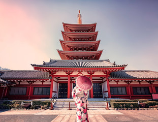 Girl with traditional dress in Senso-ji temple in Asakusa, Tokyo