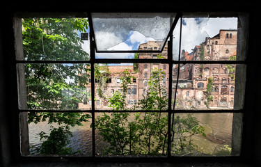 Szczecin. Old, abandoned factory halls on the river. A place called Szczecin in Venice
