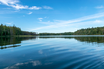beautiful lake view, beautiful sky, Calm lake reflection against the blue sky with white clouds, Valdis lake, Turna, Latvia