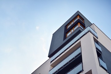 Modern apartment buildings on a sunny day with a blue sky. Facade of a modern apartment building