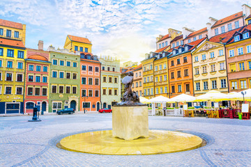 Fountain Mermaid and colorful houses on Old Town Market square in Warsaw, capital of Poland