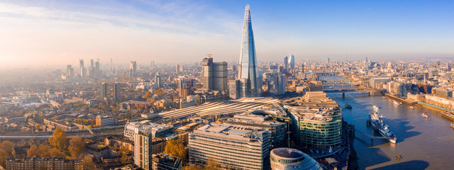 Stunning panorama view over Thames river, the Shard, the London skyline and cityscape from the skyscraper. Aerial photo over the big city.