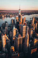 Manhattan Skyline World Trade center at sunrise, beautiful morning glow with warm sun