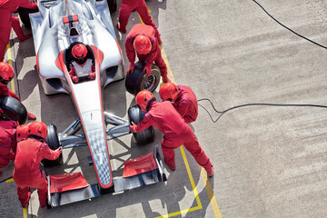 Racing team working at pit stop
