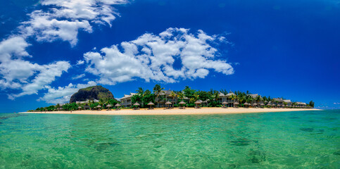 Wonderful view at a tropical island as panorama as an image travel photo. Turquise warm water in front as a panoramic total view.