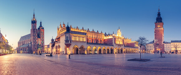 Krakow, Poland, main square night panorama with Cloth Hall and St Mary's church