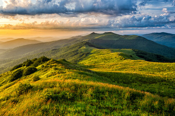 Beautiful summer mountain landscape. Green meadow and the blue sky. Polonina Wetlinska, Bieszczady, Carpathians, Poland.