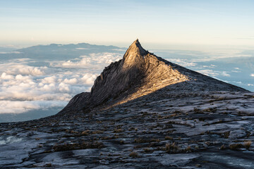 South peak of Kinabalu mountain massif in a morning sunrise, Borneo island in Sabah state, Malaysia