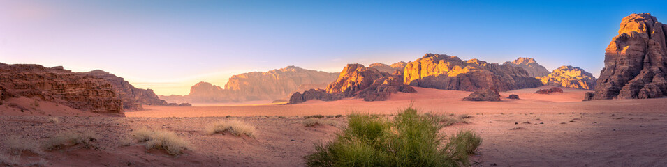 Panorama landscape shot of Wadi Rum desert in Jordan during golden hour