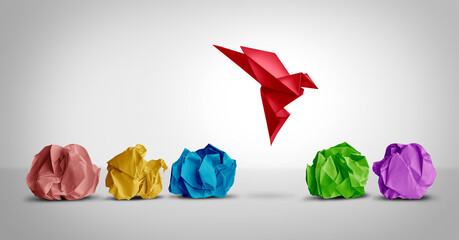 Concept of new idea and creative thinking as a symbol of innovation and inspiration metaphor as a group of crumpled papers with one different paper transforming into an origami bird in flight. 