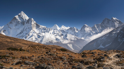 panorama of stones and mountains under blue sky in Nepal