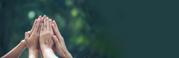 Panorama diversity multiethnic group of people success team together. Banner group of teamwork high five team together hands raise up power partner. Volunteer mission business partner with copy space