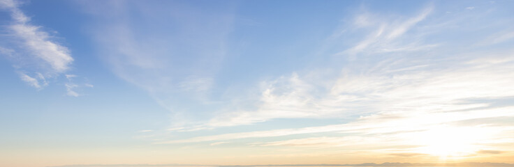 Beautiful Panoramic View of colorful cloudscape with blue Sky in Background during a sunny winter sunset. Taken in Vancouver, British Columbia, Canada.