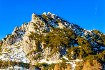 Austrian Alps covered with fresh snow during sunny winter day
