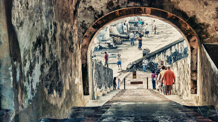 SAN JUAN - PUERTO RICO - FEB 23: Tourists along city streets on February 23, 2010 in San Juan, Puerto Rico. More than 3 million people visit the island each year