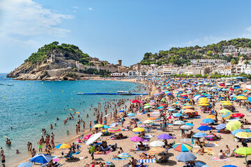 Catalunya, Tossa de Mar, Spain: 08.14.2022; The summer beach in Tossa de mar