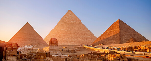 Banner view of famous wonder of world Sphinx and pyramids Giza, Egypt sunset