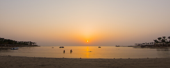 snorkeling after a warm sunrise at the beach in egypt panorama