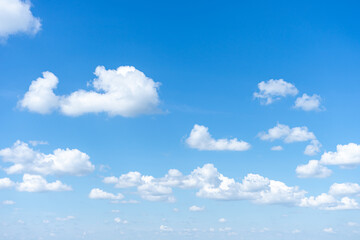 Blue sky background with small clouds.