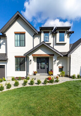 Close up shot of a Big white beautiful house in the suburbs.
