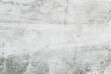  Tło, tekstura grunge naturalnej postarzanej ściany po nałożeniu siatki elewacyjnej. Klej i siatka do systemu dociepleń.