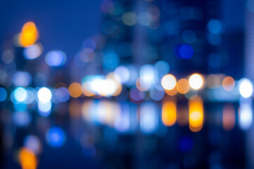 Abstract bokeh night in city background, cityscape at twilight time blurred photo