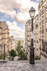 A beautiful antique street lamp in Montmartre, in Paris, France. Shallow focus for effect on the top left side of the lamp.