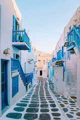Mykonos Greece , colorful streets of the old town of Mykonos with tourist in the street