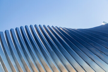 architecture and site concept - close up of modern building construction part over blue sky
