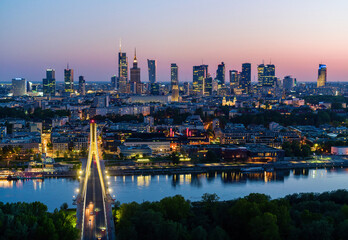 Warsaw city center, Vistula river and Swietokrzyski bridge at dusk, moody aerial landscape