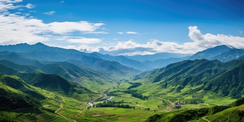 a valley with mountains in the background