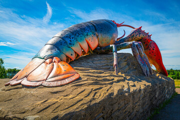 Artificial lobster on the rock in the beach