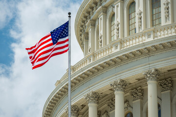 Washington DC Capitol dome detail with waving american flag