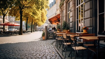 Outdoor cafe with wooden tables and chairs on a city street adorned with autumn leaves and warm sunlight. 