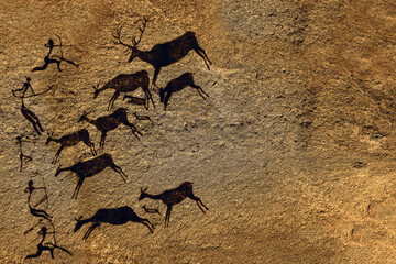 Cave art seamless pattern made of ancient wild animals, horses and hunters. Rock paintings. Hunting scenes. palaeolithic Petroglyphs carved in rocks. Stones with petroglyphs. people get food