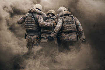 Two army soldiers helping a wounded soldier between smoke and gas in destroyed city