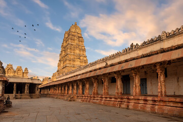 Medieval architecture stone structure with archeological ruins of Virupaksha temple at Hampi, Karnataka, India. 