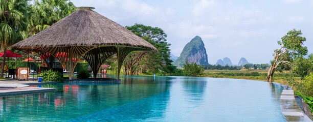 Infinity pool and peaceful panoramic natural view bring to relaxation moment in Hoa Binh province, Vietnam