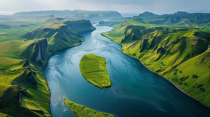 Aerial view of a mountainous region with a river running through it, where the natural contours of the land and the flowing water create a dynamic and abstract landscape. Abstract Backgrounds